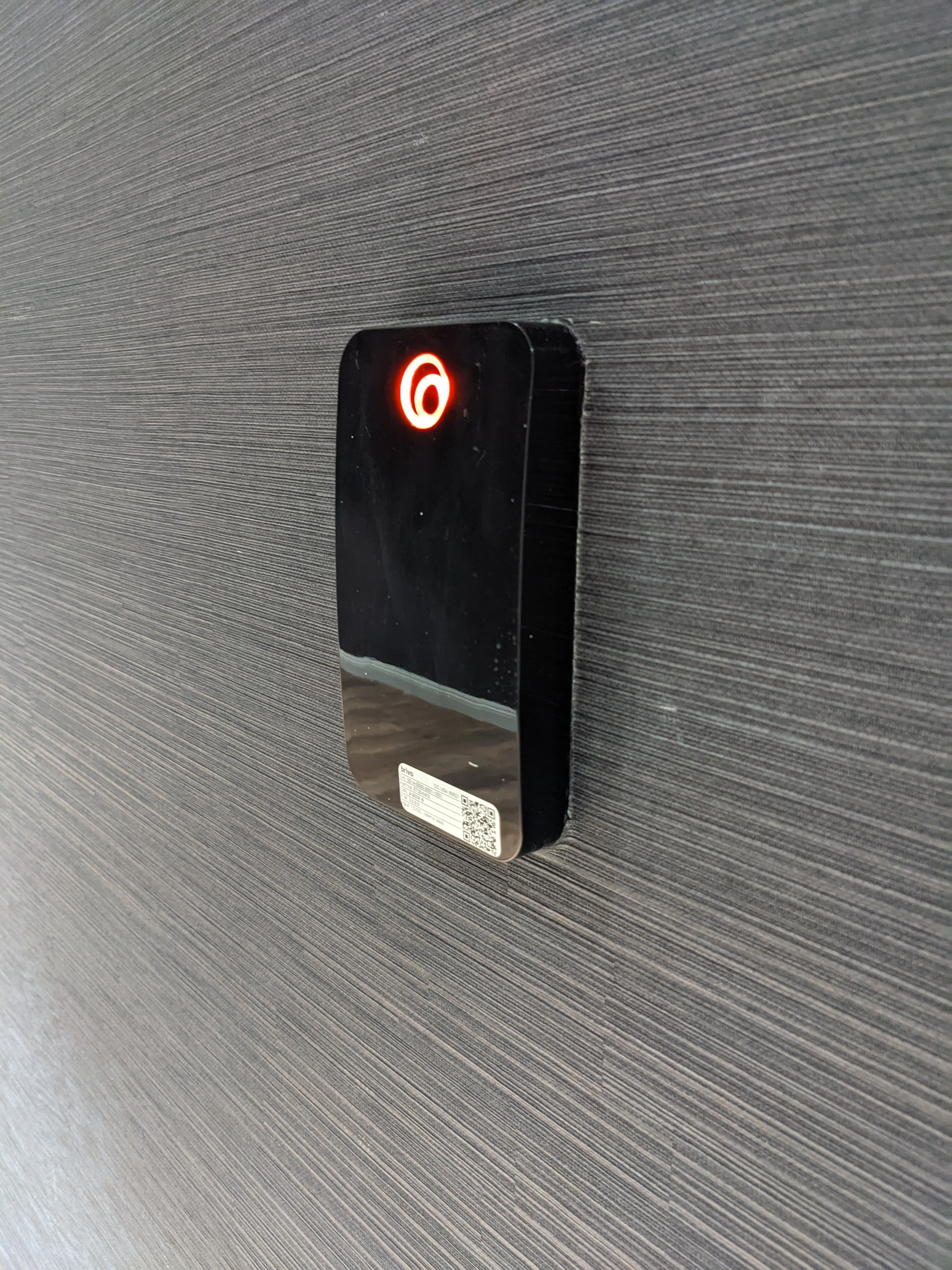 A Brivo cloud-based access control card reader mounted beside a door