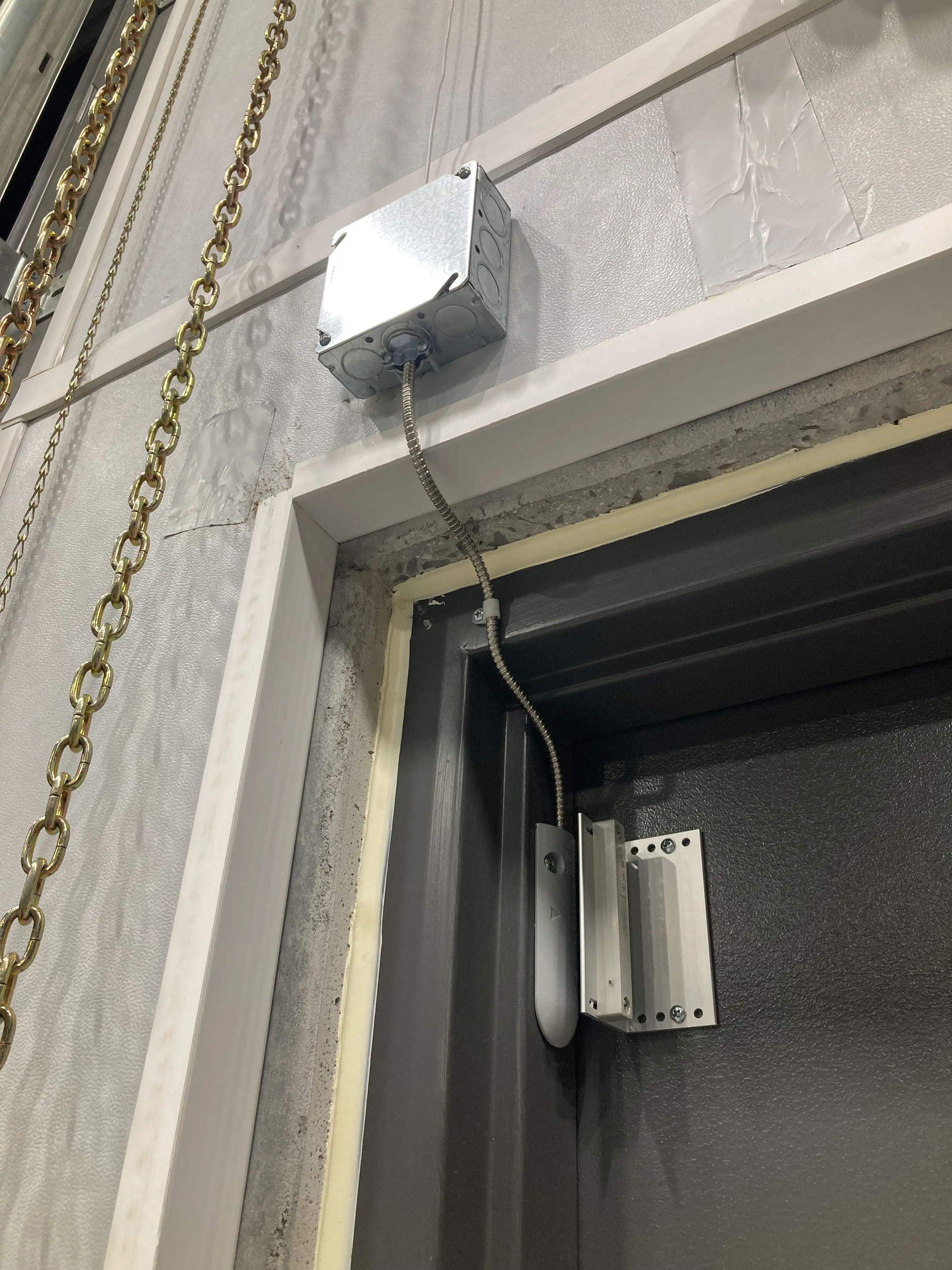Potter ODC-59 door contact installed on a steel warehouse door